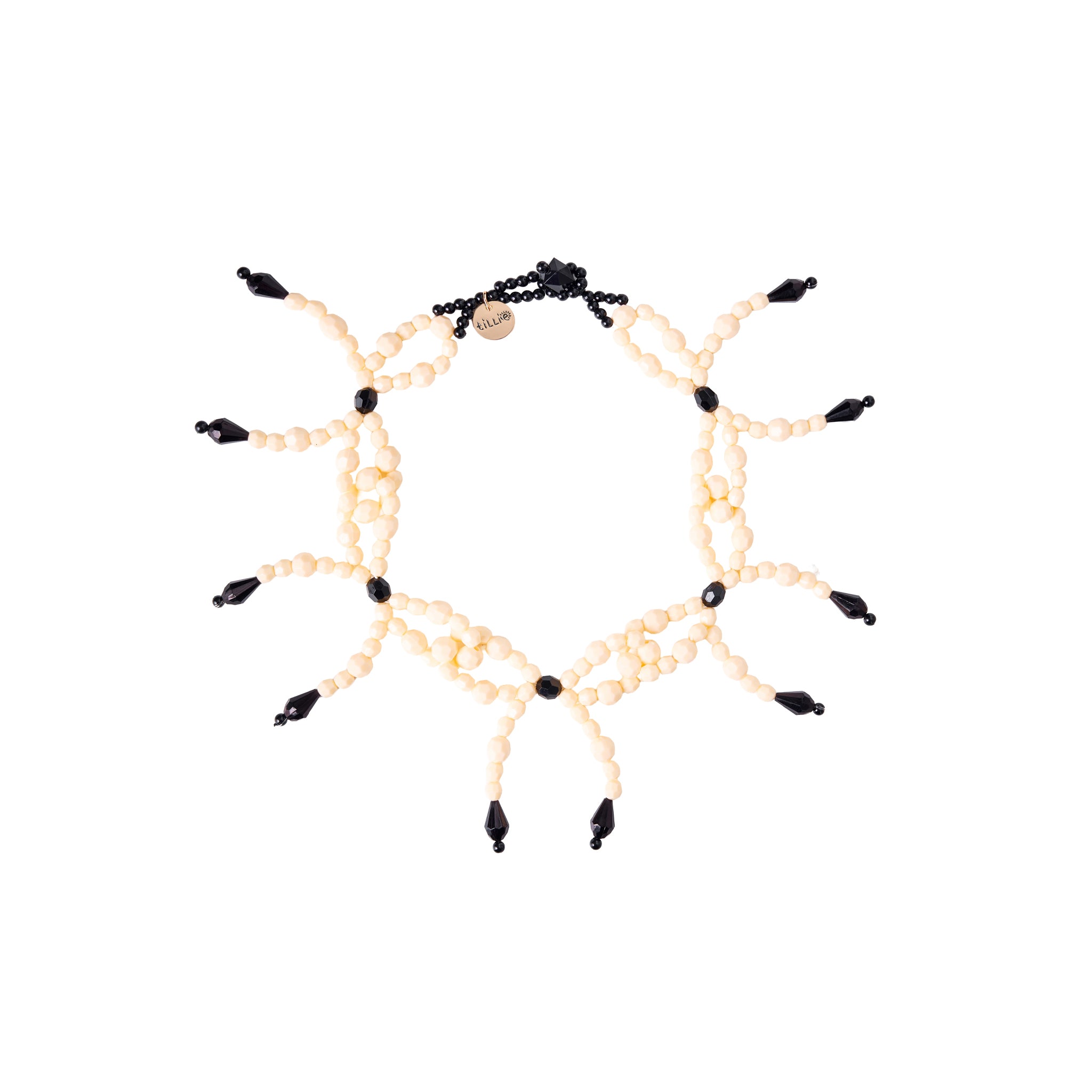 Prepare for a party on your neckline with Tillie Beads' Ribbon Riot Necklace! Handcrafted with playful ribbons and sparkly beads, it's a whimsical accessory that screams fun and style. Get ready to turn heads and spread joy wherever you go!