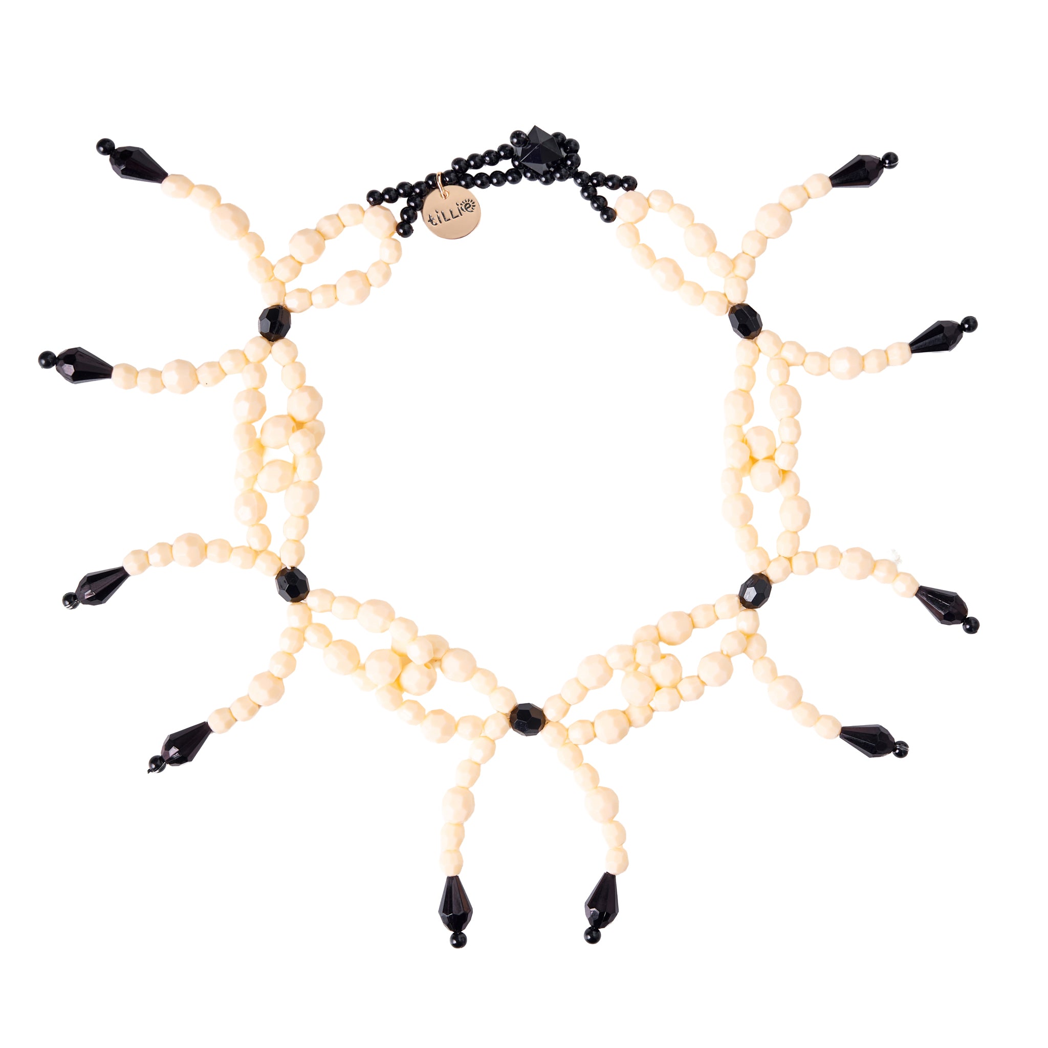 Prepare for a party on your neckline with Tillie Beads' Ribbon Riot Necklace! Handcrafted with playful ribbons and sparkly beads, it's a whimsical accessory that screams fun and style. Get ready to turn heads and spread joy wherever you go!